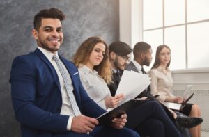 Job candidates waiting for their turn at an employment agency interview.